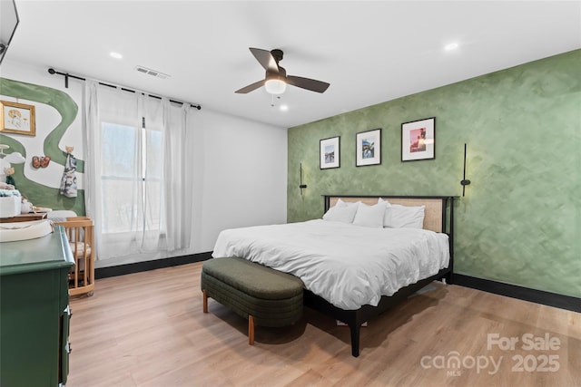 5501 Joyce Dr, Charlotte, NC 28215 - bedroom with light wood-style floors, baseboards, recessed lighting, and an accent wall