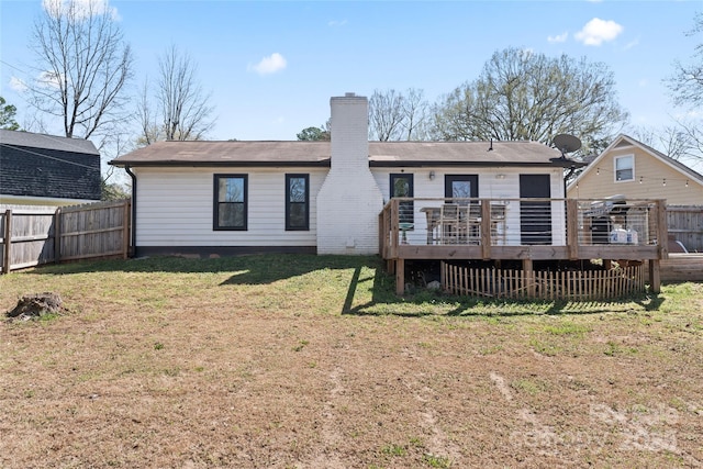 5501 Joyce Dr, Charlotte, NC 28215 - back of house featuring a chimney and a wooden deck