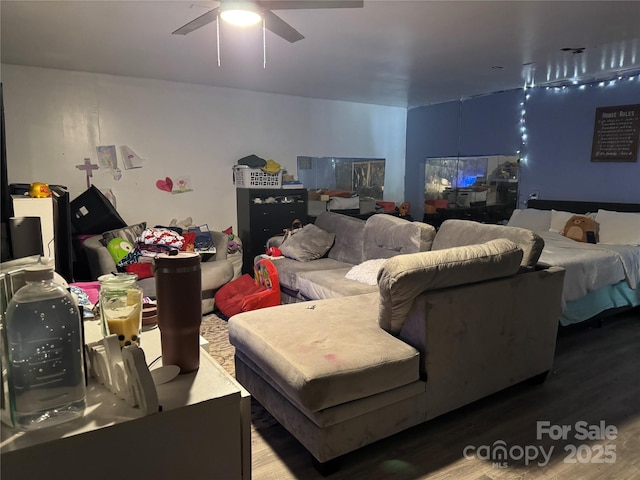 bedroom featuring a ceiling fan and wood finished floors