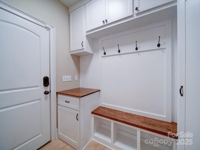 mudroom with light tile patterned floors