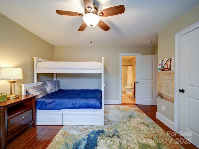 bedroom with ensuite bathroom, a ceiling fan, baseboards, and wood finished floors