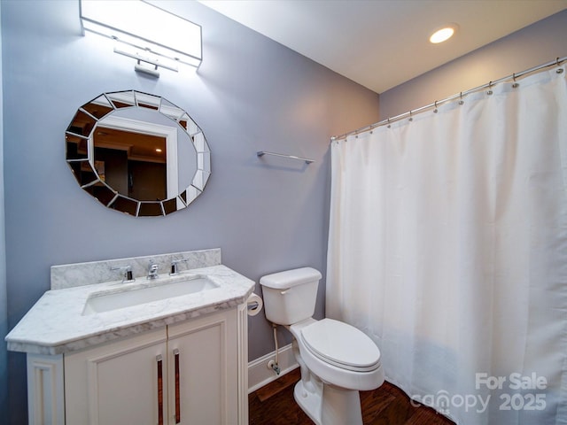 full bathroom with vanity, toilet, recessed lighting, baseboards, and wood finished floors