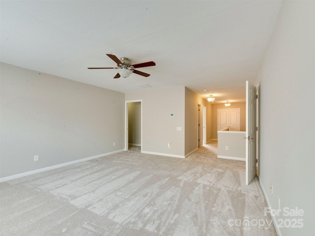 9607 Kestral Ridge Dr, Charlotte, NC 28269 - unfurnished living room featuring light colored carpet, ceiling fan, and baseboards