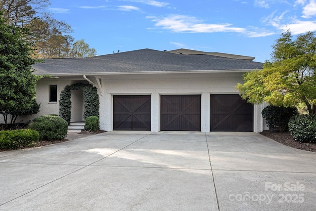 19117 Davidson Concord Rd, Davidson, NC 28036 - view of front of home with concrete driveway, a garage, roof with shingles, and stucco siding