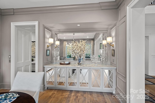 19117 Davidson Concord Rd, Davidson, NC 28036 - bar area with a decorative wall, ornamental molding, and wood finished floors