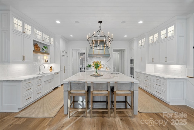 19117 Davidson Concord Rd, Davidson, NC 28036 - kitchen featuring a sink, white cabinetry, tasteful backsplash, and recessed lighting