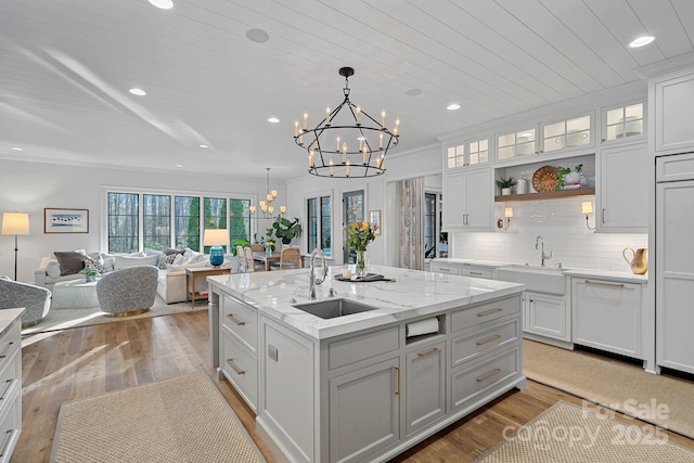19117 Davidson Concord Rd, Davidson, NC 28036 - kitchen featuring a sink, a chandelier, an island with sink, light wood-style flooring, and recessed lighting