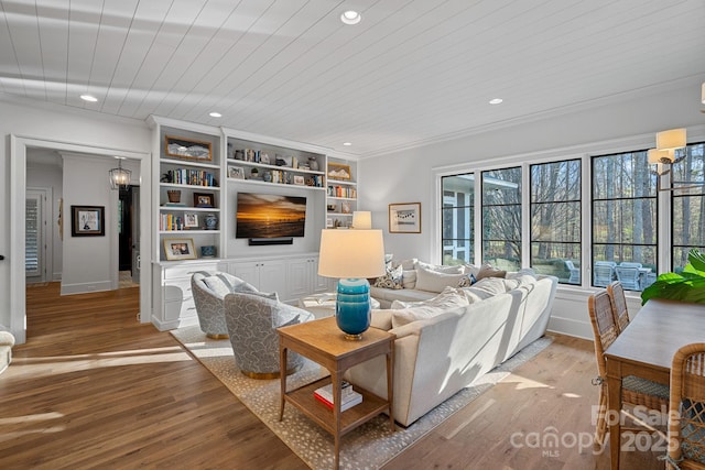 19117 Davidson Concord Rd, Davidson, NC 28036 - living room with light wood-style floors, built in features, recessed lighting, crown molding, and baseboards