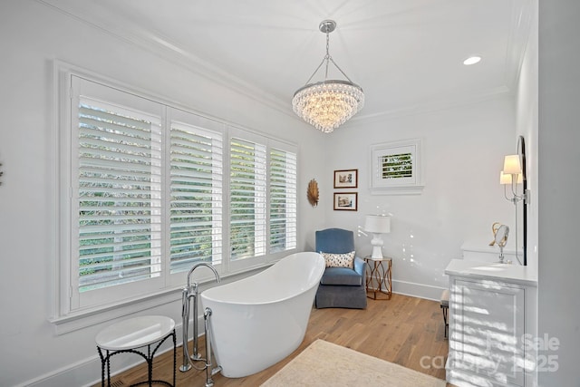 19117 Davidson Concord Rd, Davidson, NC 28036 - sitting room featuring ornamental molding, wood finished floors, a chandelier, and baseboards