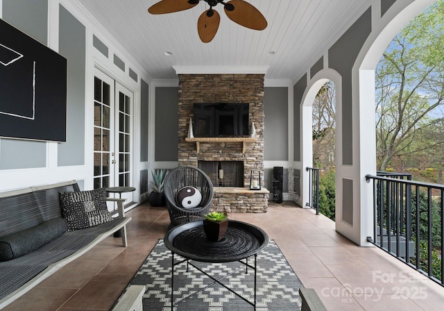 21311 Baltic Dr, Cornelius, NC 28031 - view of patio / terrace with french doors, an outdoor living space with a fireplace, and a ceiling fan
