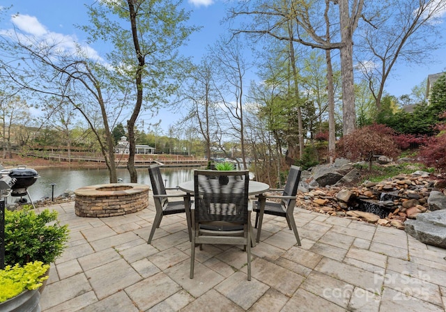 21311 Baltic Dr, Cornelius, NC 28031 - view of patio / terrace with a water view, outdoor dining area, and an outdoor fire pit
