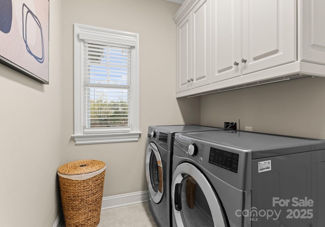 21311 Baltic Dr, Cornelius, NC 28031 - laundry area with washing machine and dryer, baseboards, and cabinet space