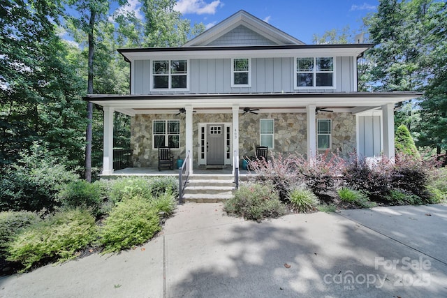 463 Lake Wylie Rd, Belmont, NC 28012 - view of front of house with covered porch, stone siding, ceiling fan, and board and batten siding