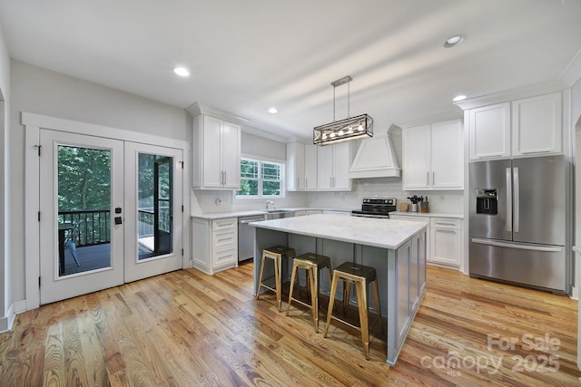 463 Lake Wylie Rd, Belmont, NC 28012 - kitchen featuring appliances with stainless steel finishes, custom exhaust hood, backsplash, white cabinets, and recessed lighting