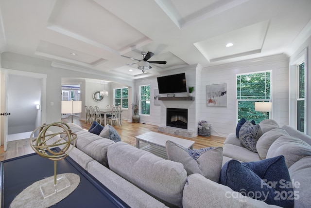 463 Lake Wylie Rd, Belmont, NC 28012 - living area with wood finished floors, a ceiling fan, arched walkways, a fireplace, and coffered ceiling