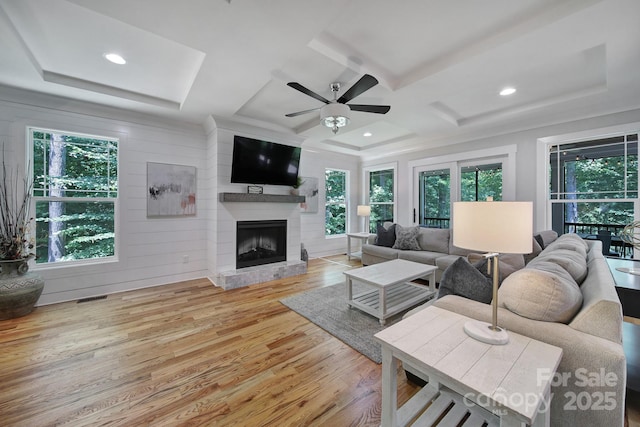 463 Lake Wylie Rd, Belmont, NC 28012 - living area featuring plenty of natural light, wood finished floors, a fireplace, coffered ceiling, and recessed lighting