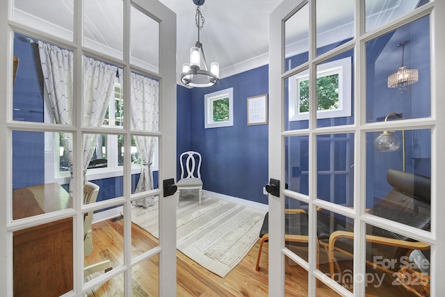 463 Lake Wylie Rd, Belmont, NC 28012 - dining space with a chandelier, french doors, and wood finished floors