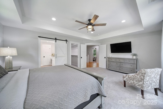 463 Lake Wylie Rd, Belmont, NC 28012 - carpeted bedroom with a tray ceiling, a barn door, recessed lighting, and ceiling fan