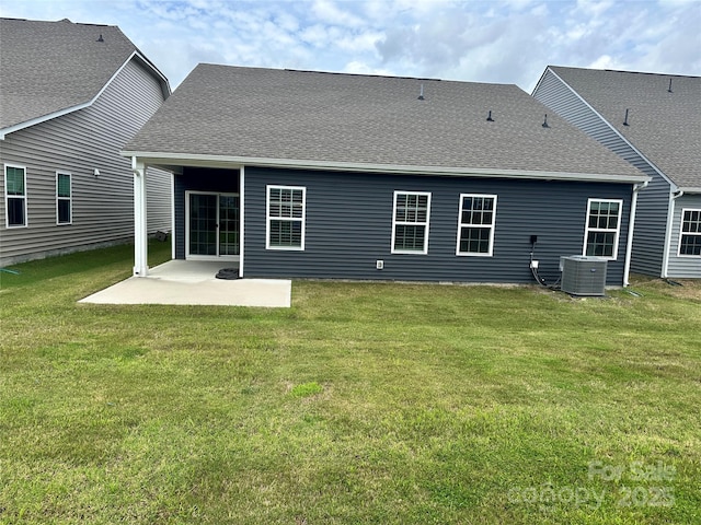 1032 Barnette Farm Ln, Monroe, NC 28110 - back of property featuring a patio, a lawn, and a shingled roof