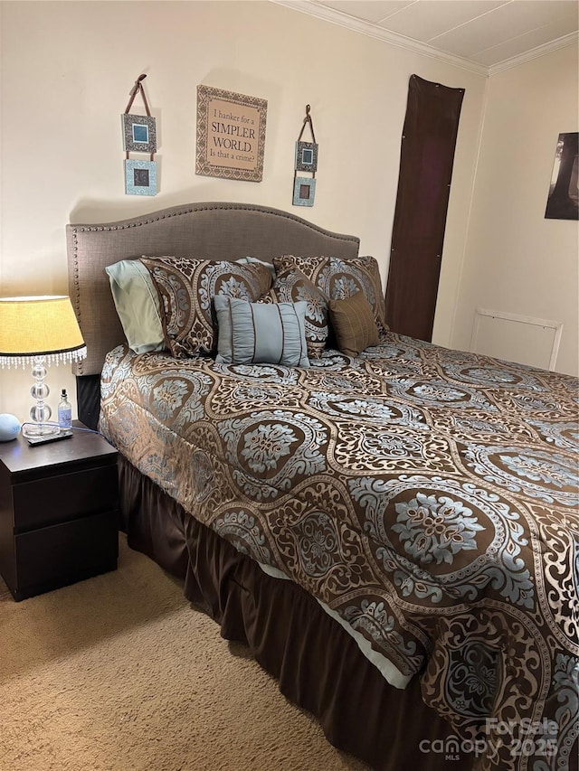 bedroom featuring carpet floors and ornamental molding