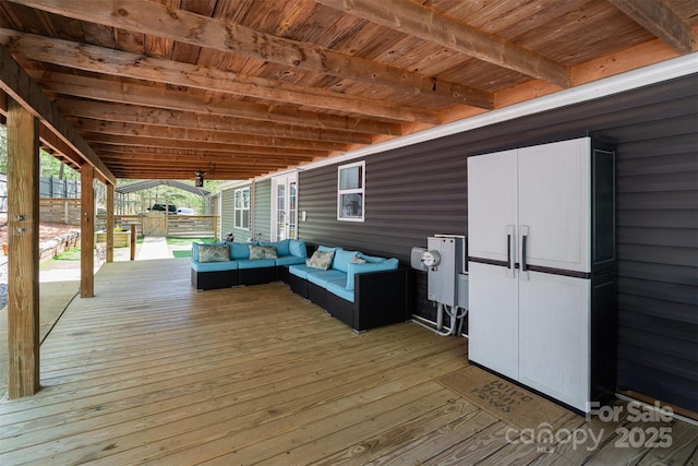 wooden deck with an outdoor living space