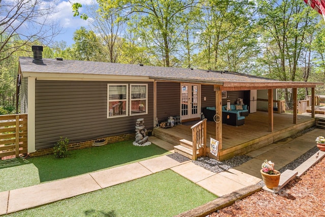 view of front of property featuring french doors, fence, and a deck