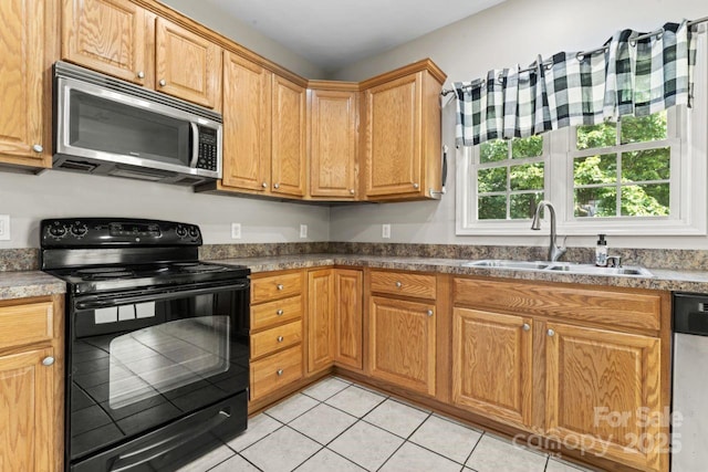 145 Mcbride Dr, Rockwell, NC 28138 - kitchen with appliances with stainless steel finishes, a sink, and light tile patterned floors