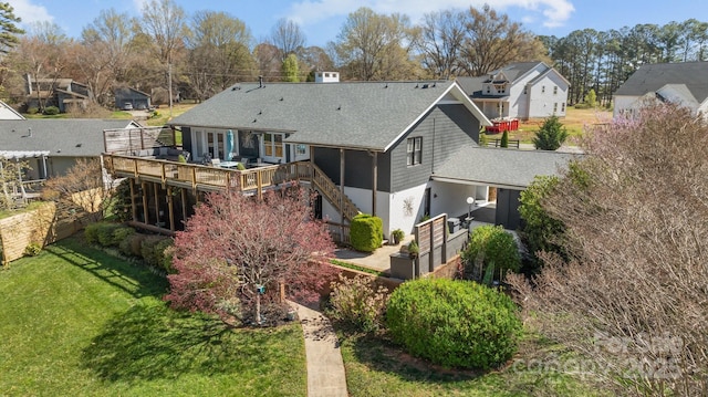 15921 Cramur Dr, Huntersville, NC 28078 - back of property featuring stairway, fence, a wooden deck, a residential view, and a lawn
