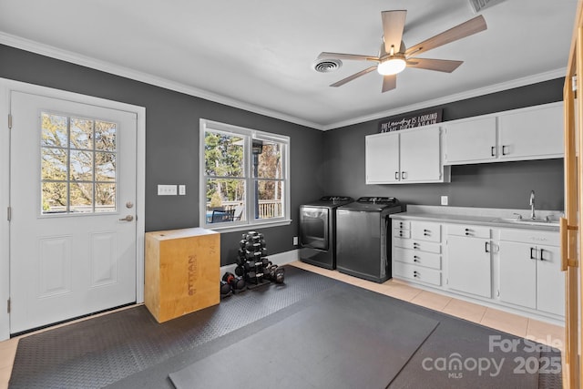 15921 Cramur Dr, Huntersville, NC 28078 - interior space featuring ornamental molding, washing machine and clothes dryer, a sink, visible vents, and cabinet space