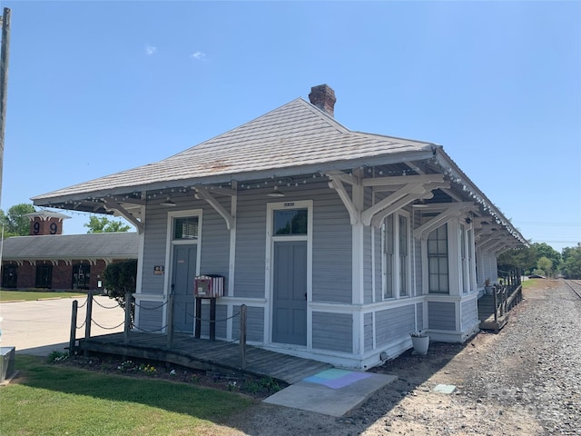 325 E St, Heath Springs, SC 29058 - view of front facade with a chimney and a porch