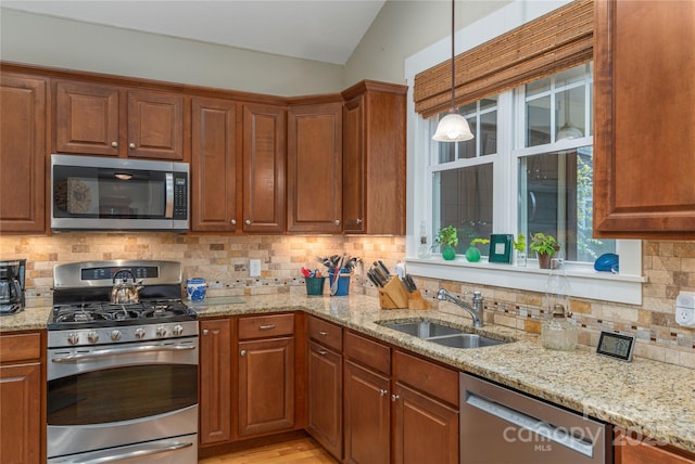4 Silo View Ct, Asheville, NC 28804 - kitchen featuring stainless steel appliances, a sink, decorative backsplash, light stone countertops, and lofted ceiling
