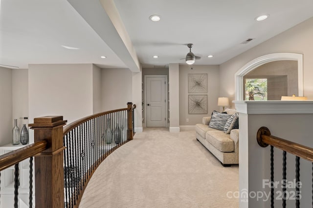 living area featuring baseboards, recessed lighting, an upstairs landing, and carpet flooring