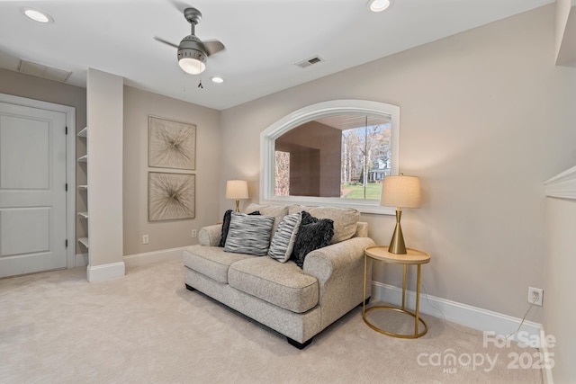 carpeted living area featuring a ceiling fan, recessed lighting, baseboards, and visible vents
