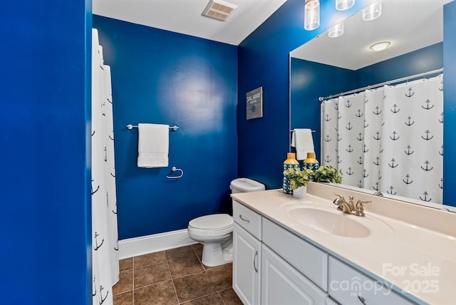 bathroom with toilet, vanity, tile patterned flooring, baseboards, and visible vents