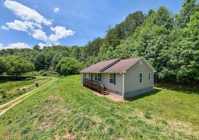 42 Leonard Davis Rd, Robbinsville, NC 28771 - view of front facade with crawl space, a forest view, and a front yard