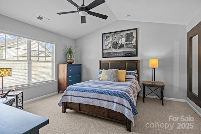 carpeted bedroom featuring lofted ceiling, visible vents, a ceiling fan, and baseboards