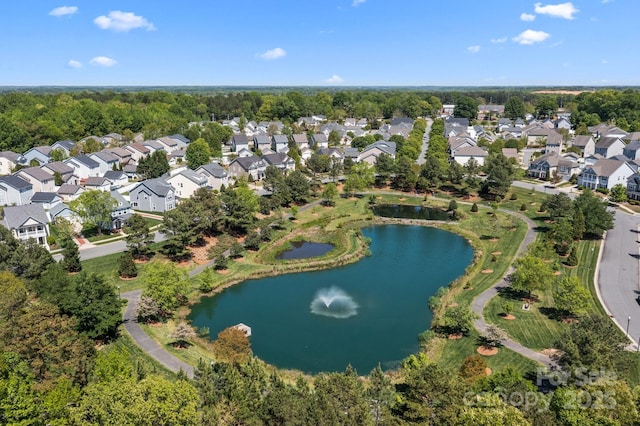birds eye view of property with a residential view and a water view