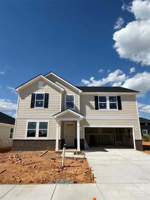 317 Maidstone Dr Unit 57, Monroe, NC 28110 - traditional home with an attached garage, brick siding, and driveway