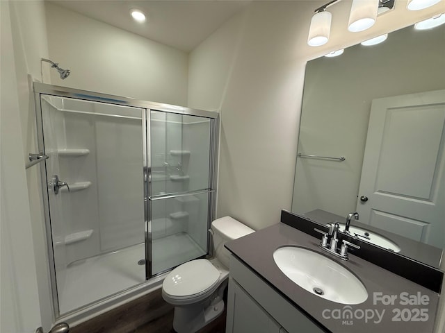 317 Maidstone Dr Unit 57, Monroe, NC 28110 - bathroom with a shower stall, vanity, wood finished floors, and recessed lighting