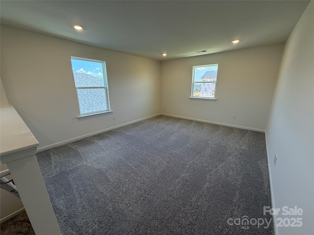 317 Maidstone Dr Unit 57, Monroe, NC 28110 - spare room featuring dark colored carpet and recessed lighting