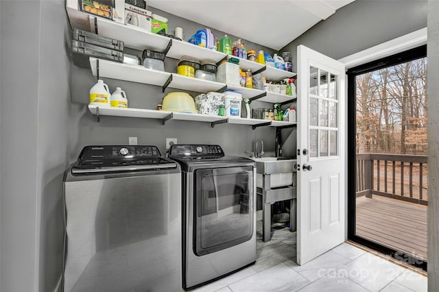 washroom with washer and dryer and laundry area