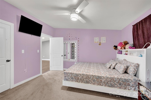 bedroom with baseboards, ceiling fan, and carpet
