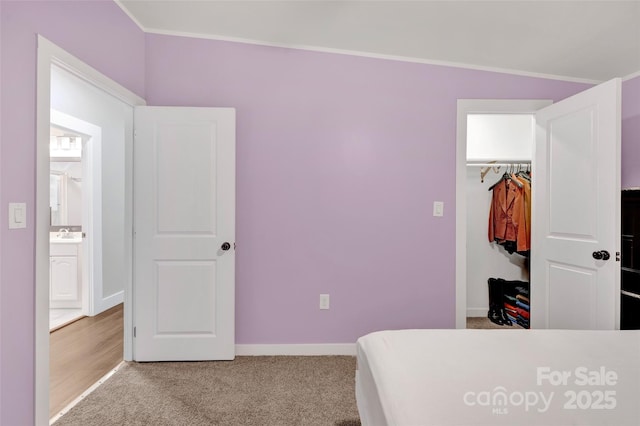 bedroom with carpet floors and baseboards
