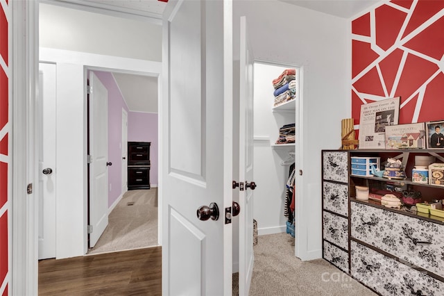 hallway with carpet flooring