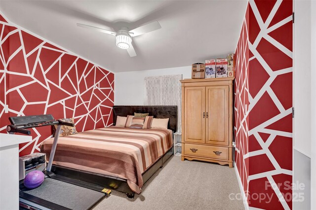 bedroom with light carpet and a ceiling fan