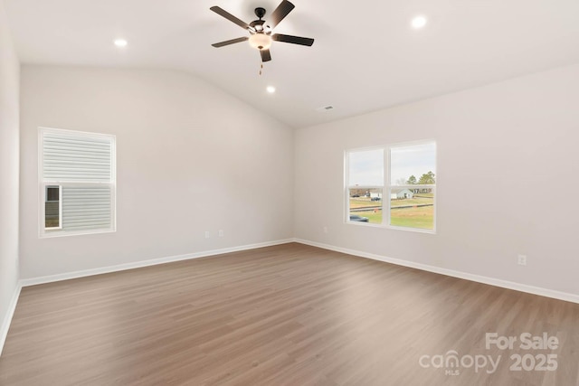 unfurnished room featuring a ceiling fan, wood finished floors, baseboards, recessed lighting, and vaulted ceiling