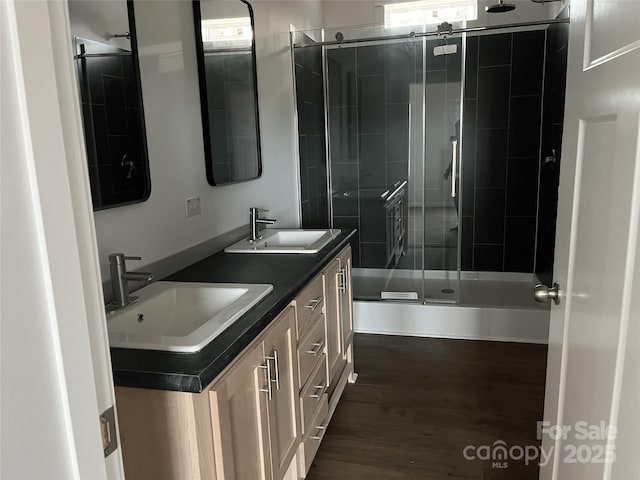 2070 Travis Rd, Conover, NC 28613 - full bath with tiled shower, wood finished floors, and double vanity