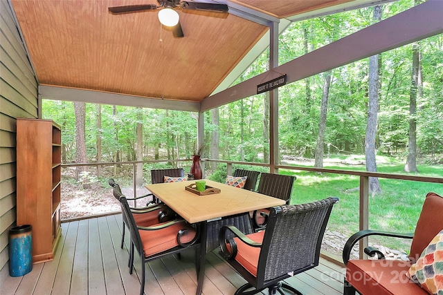 sunroom / solarium with ceiling fan and outdoor dining area