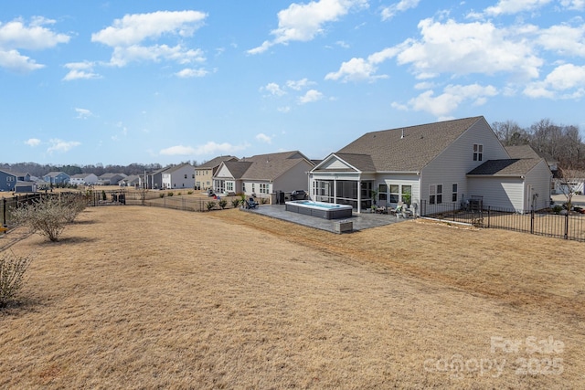 1512 Brooksland Pl, Waxhaw, NC 28173 - back of house featuring a sunroom, a residential view, a patio, a hot tub, and roof with shingles