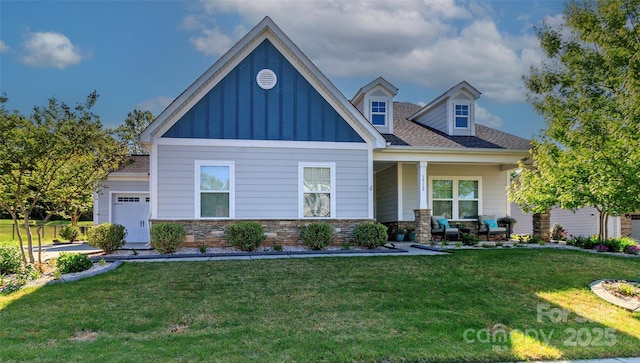 1512 Brooksland Pl, Waxhaw, NC 28173 - craftsman house with board and batten siding, an attached garage, a front lawn, and stone siding